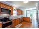 Spacious kitchen with stainless steel appliances and hardwood floors at 4083 Brookside Manor Dr, Tucker, GA 30084