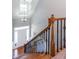 Elegant staircase with wood railing and wrought iron balusters at 4083 Brookside Manor Dr, Tucker, GA 30084