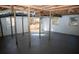 Unfinished basement with high ceilings, windows, and access to outside at 3685 Emily Way, Atlanta, GA 30349