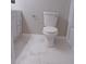 Clean bathroom with toilet and marble floor at 3685 Emily Way, Atlanta, GA 30349