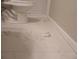 White marble-look bathroom floor tile at 3685 Emily Way, Atlanta, GA 30349