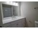 This bathroom offers a large mirror and vanity with plenty of storage at 3685 Emily Way, Atlanta, GA 30349