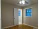 Bedroom with hardwood floors, a window, and a door to bathroom at 3685 Emily Way, Atlanta, GA 30349