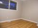 Hardwood floor bedroom with neutral wall paint at 3685 Emily Way, Atlanta, GA 30349