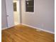 Bedroom with hardwood floors, window and door to bathroom at 3685 Emily Way, Atlanta, GA 30349