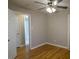 Bedroom with hardwood floors and view to bathroom at 3685 Emily Way, Atlanta, GA 30349