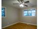 Well-lit bedroom featuring hardwood floors and a ceiling fan at 3685 Emily Way, Atlanta, GA 30349