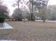 Residential front yard with mature trees at 3685 Emily Way, Atlanta, GA 30349