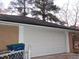 White garage door with black roof at 3685 Emily Way, Atlanta, GA 30349