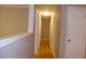 Bright hallway with hardwood floors and neutral walls at 3685 Emily Way, Atlanta, GA 30349