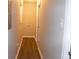 Laundry area and linen closet in this long hallway at 3685 Emily Way, Atlanta, GA 30349