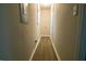 Clean hallway with light neutral walls and wood flooring at 3685 Emily Way, Atlanta, GA 30349