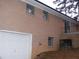 Brick house with attached garage and a balcony at 3685 Emily Way, Atlanta, GA 30349