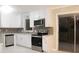 Modern kitchen with white cabinets and stainless steel appliances at 3685 Emily Way, Atlanta, GA 30349