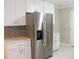 Stainless steel refrigerator and white cabinets at 3685 Emily Way, Atlanta, GA 30349