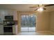 Bright kitchen with access to outdoor balcony/patio at 3685 Emily Way, Atlanta, GA 30349