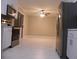 Open concept kitchen with tile floors and lots of natural light at 3685 Emily Way, Atlanta, GA 30349