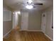 Hardwood floors and neutral walls in this spacious living room at 3685 Emily Way, Atlanta, GA 30349