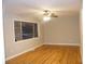 Spacious living room with hardwood floors and ceiling fan at 3685 Emily Way, Atlanta, GA 30349