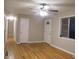 Hardwood floor living room with neutral walls and ceiling fan at 3685 Emily Way, Atlanta, GA 30349