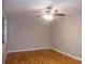 Hardwood floor living room with neutral walls and ceiling fan at 3685 Emily Way, Atlanta, GA 30349