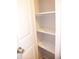 Open pantry with three shelves for storage at 3685 Emily Way, Atlanta, GA 30349