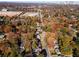 Aerial view showcasing the neighborhood's autumn foliage and city skyline at 921 Byron Sw Dr, Atlanta, GA 30310