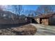 Spacious backyard with a concrete driveway and mature trees at 557 Mccullough Rd, Stockbridge, GA 30281