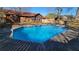 Large refreshing pool in a fenced backyard with a home in the background at 557 Mccullough Rd, Stockbridge, GA 30281