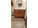 Clean bathroom with wood vanity and tile floor at 557 Mccullough Rd, Stockbridge, GA 30281