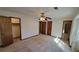Spacious bedroom with ample closet space and neutral carpeting at 557 Mccullough Rd, Stockbridge, GA 30281