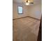 Spacious carpeted bedroom with a ceiling fan and window at 557 Mccullough Rd, Stockbridge, GA 30281