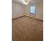 Bright bedroom with carpeted floors and a window at 557 Mccullough Rd, Stockbridge, GA 30281