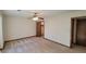 Well-lit bedroom with ceiling fan and carpeting at 557 Mccullough Rd, Stockbridge, GA 30281