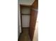 Empty closet with wood-framed door and shelving at 557 Mccullough Rd, Stockbridge, GA 30281