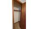 Empty closet with a hanging rod and wood doors at 557 Mccullough Rd, Stockbridge, GA 30281