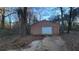 Single car detached garage with a concrete driveway at 557 Mccullough Rd, Stockbridge, GA 30281