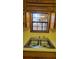 Kitchen features a double sink and wood cabinets at 557 Mccullough Rd, Stockbridge, GA 30281