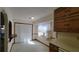 Eat-in kitchen with white cabinets and light countertops at 557 Mccullough Rd, Stockbridge, GA 30281
