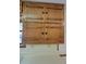 Close-up view of wood kitchen cabinets with black knobs at 557 Mccullough Rd, Stockbridge, GA 30281