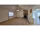 Living room with stone fireplace and view to kitchen at 557 Mccullough Rd, Stockbridge, GA 30281