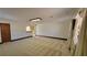 Large living room with neutral carpeting and wood trim at 557 Mccullough Rd, Stockbridge, GA 30281