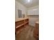 Well-lit storage room with built-in shelves and cabinets at 557 Mccullough Rd, Stockbridge, GA 30281