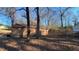 Wooden storage shed with stone base and adjacent woods at 557 Mccullough Rd, Stockbridge, GA 30281