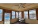 Sunroom with pool access and small table set at 557 Mccullough Rd, Stockbridge, GA 30281