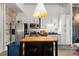 Contemporary kitchen featuring a kitchen island, stainless steel appliances, and white cabinetry at 978 North Ne Ave # 107, Atlanta, GA 30306