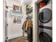 Well organized laundry space with hanging rack, shelving and stacked washer and dryer at 978 North Ne Ave # 107, Atlanta, GA 30306