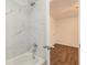 Bathroom with marble shower and a white bathtub at 261 Quail Run, Roswell, GA 30076