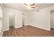 Bright bedroom with wood-look floors and ample closet space at 261 Quail Run, Roswell, GA 30076