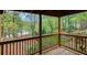 Deck with scenic wooded views and a pool at 261 Quail Run, Roswell, GA 30076